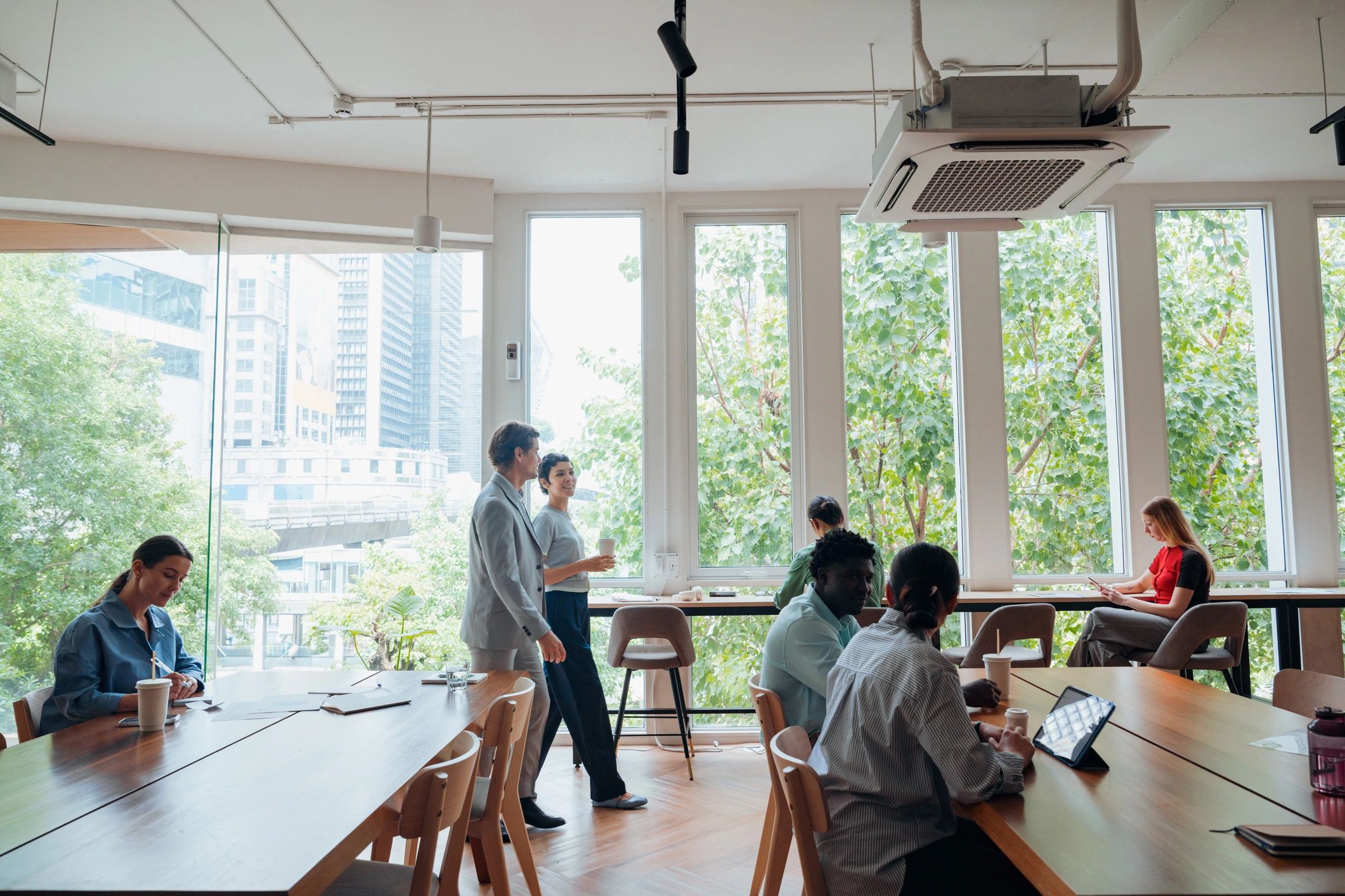 Diverse business professionals working in modern coworking office